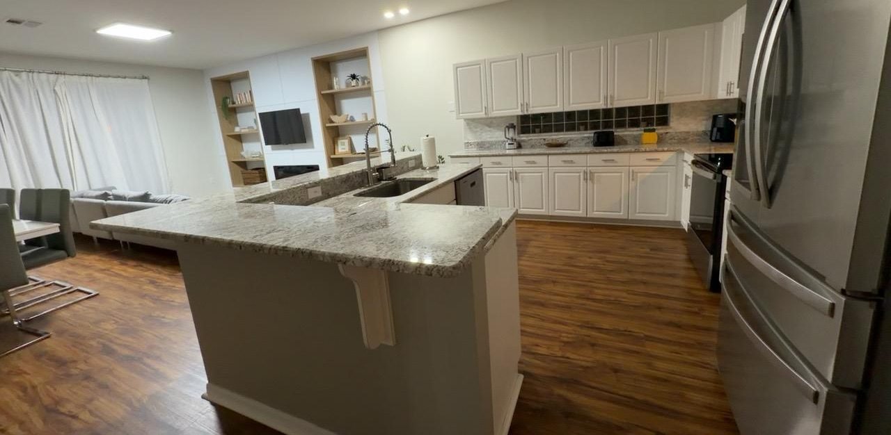 Clean kitchen with granite counters